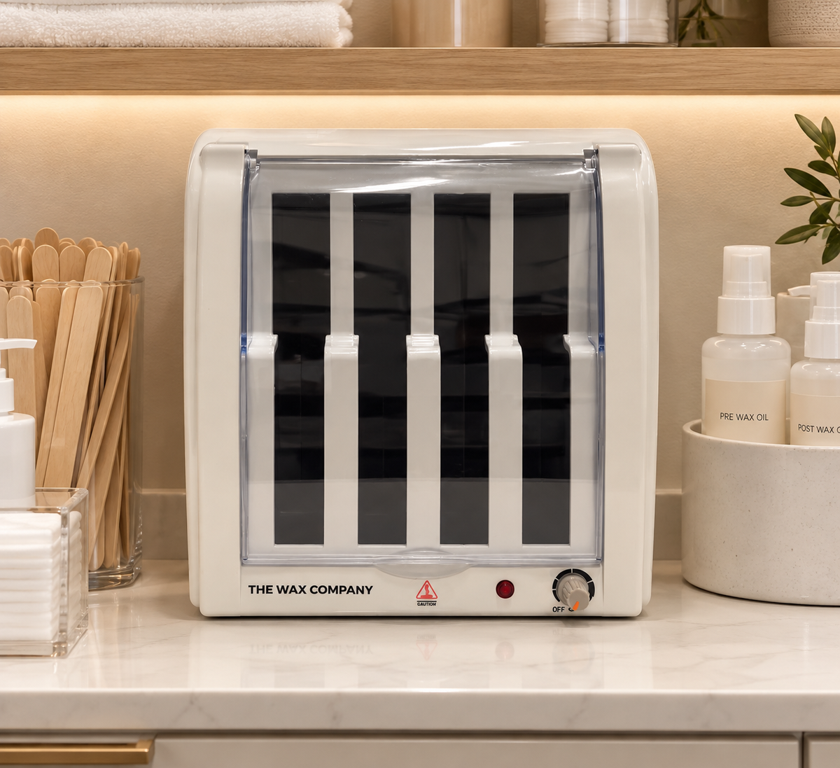 Roller wax warmer with a clear front door and four vertical wax slots
